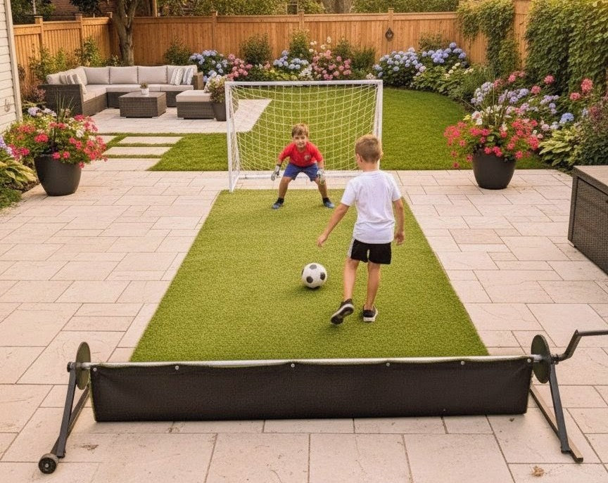 Two children practicing soccer drills with a small goal on the PlayTurfs portable artificial turf system on a patio.
